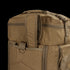 Close-up of the Condor Colossus Duffle Bag 60L in brown, featuring a top handle, zipper, and a metal D-ring on a fabric loop—perfect for first responders or law enforcement.